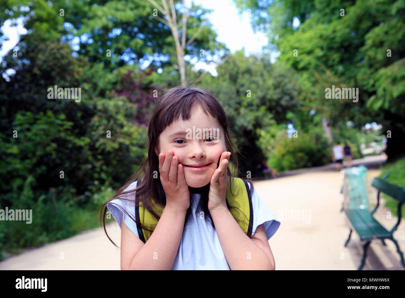 Portrait of little girl smiling in the park Stock Photo - Alamy