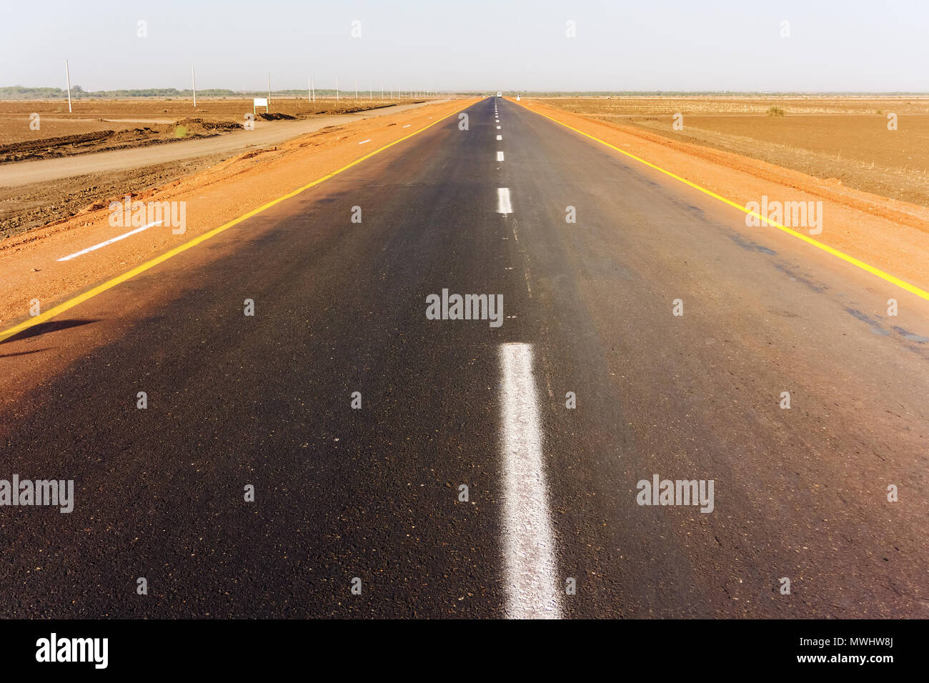 Tarmac road in the Sahara desert near Sennar in Sudan Stock Photo