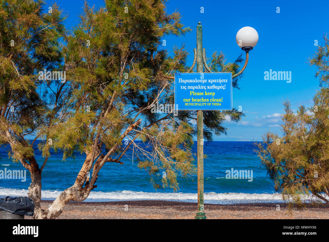 Please Keep Our Beaches Clean Warning Sign on Beach in Santorini Greece Stock Photo