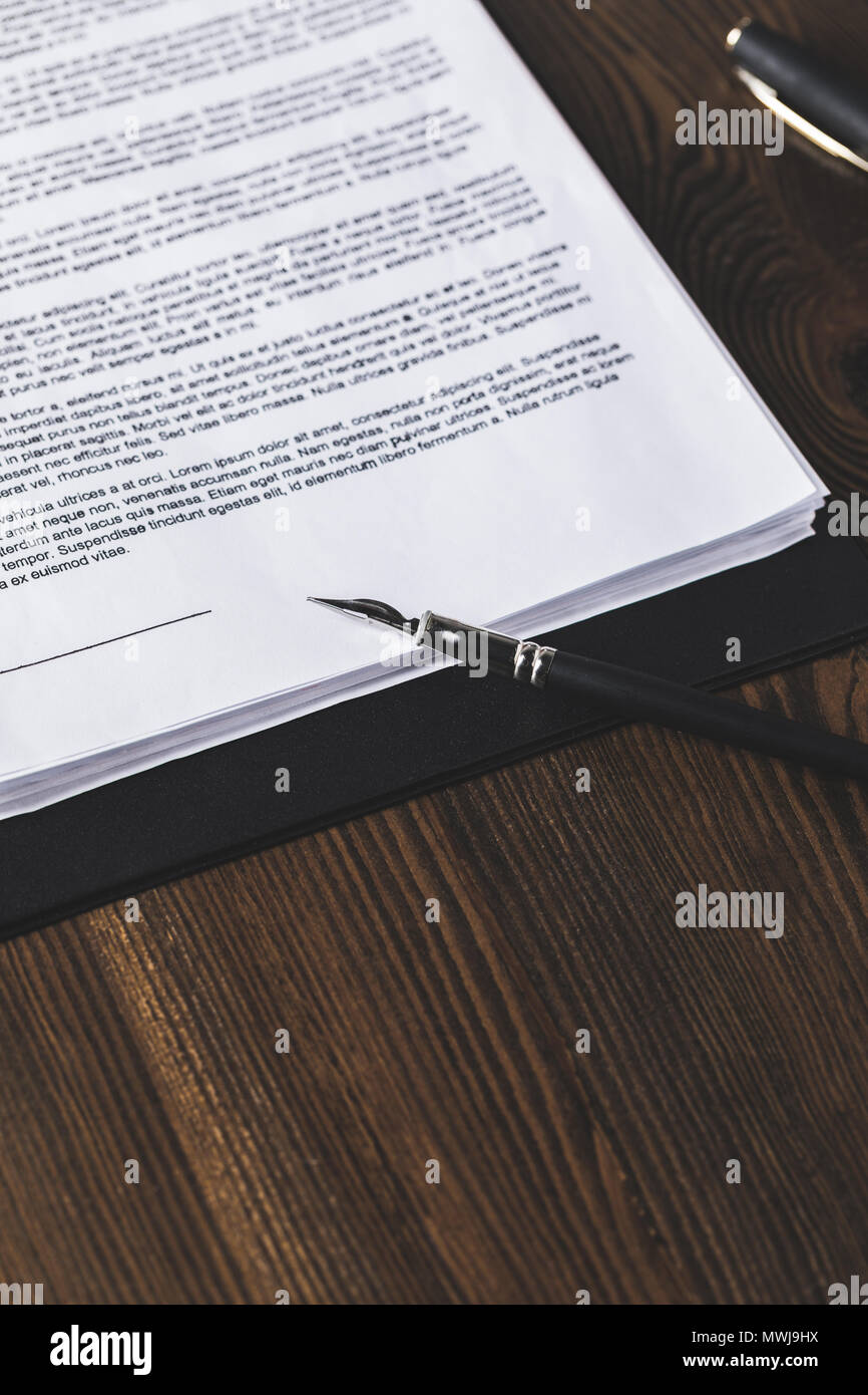 juridical contract on wooden table with pen, law concept Stock Photo