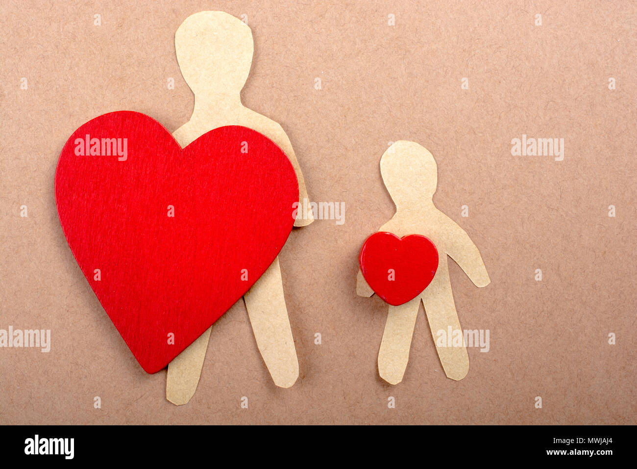 Love concept for with paper hearts and paper man Stock Photo - Alamy