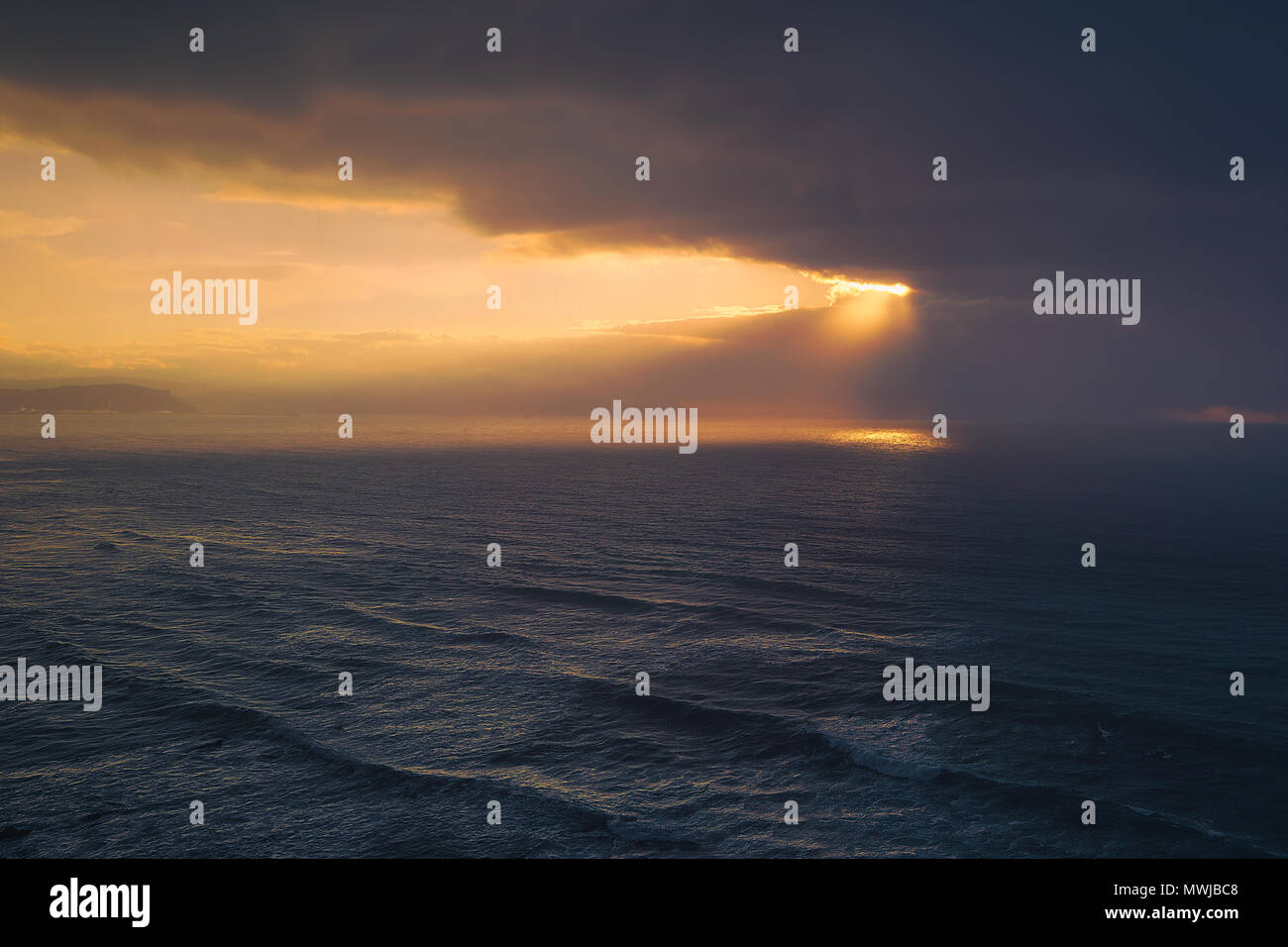 seascape with golden sun rays and stormy clouds Stock Photo - Alamy