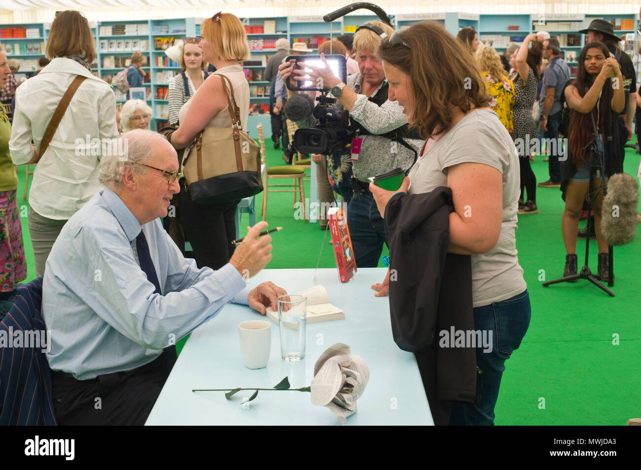 Alexander McCall Smith signing books for fans in the bookshop at Hay Festival 2018 Hay-on-Wye Powys Wales UK Stock Photo
