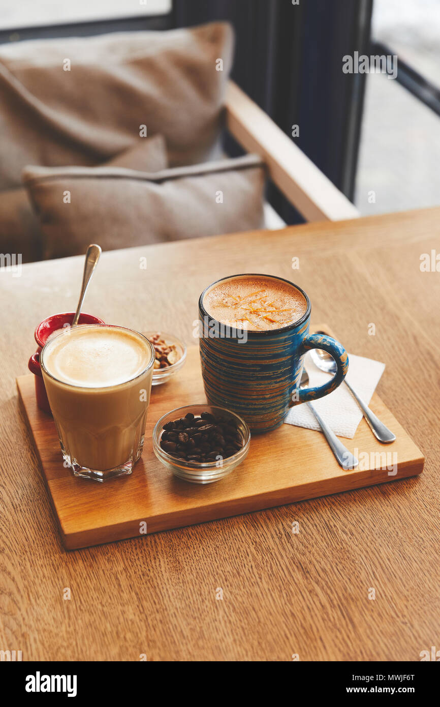 Coffee beverages with milk on cafe table Stock Photo