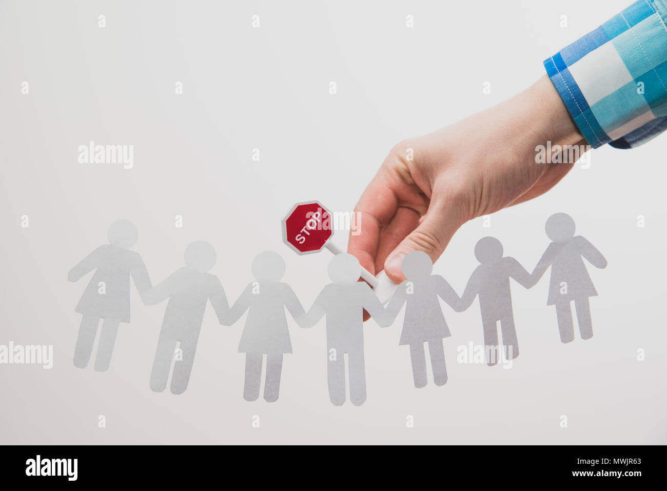 A businessman, a man holding a sign in his hand with the word stop on ...