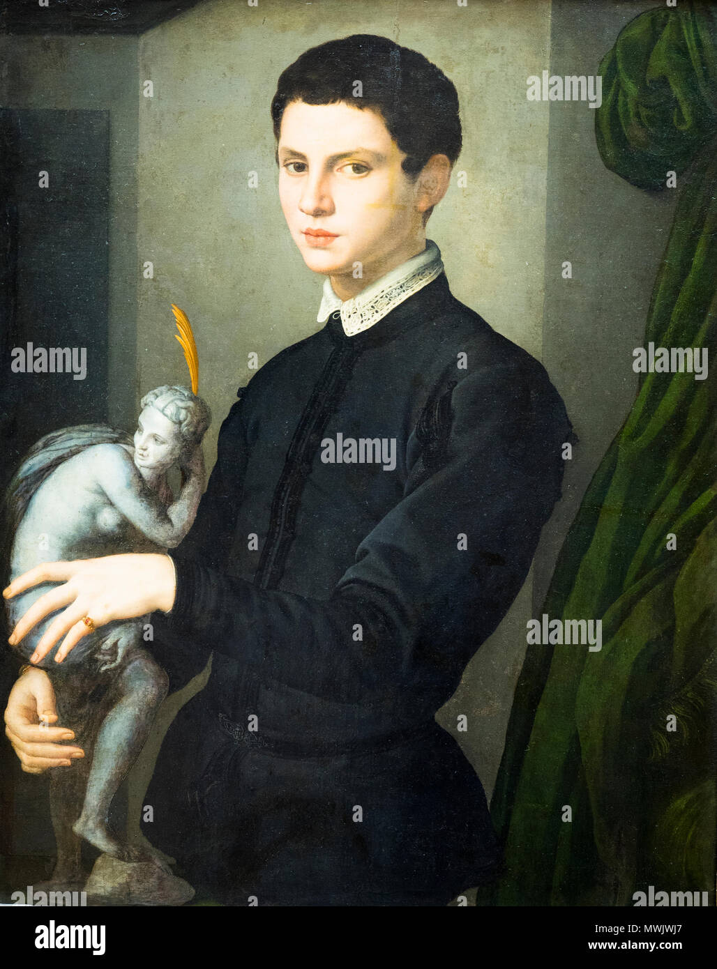 Portrait of a man holding a statuette by Agnolo di Cosimo di Mariano Tori known as Bronzino (1503-1572) Stock Photo