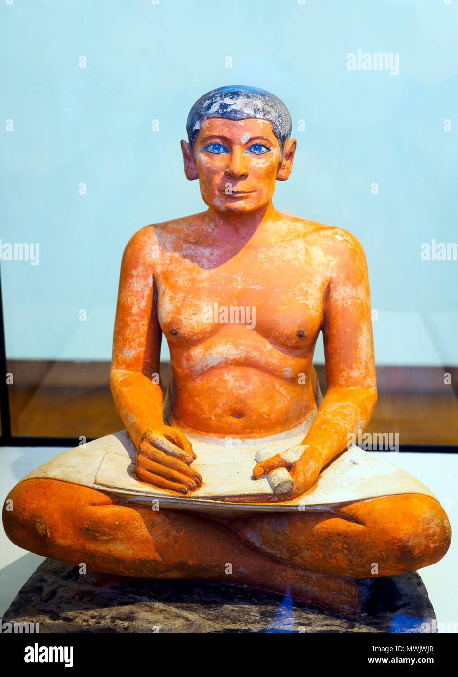 Egyptian art. Seated Scribe. Old Kingdom. 2600-2350 BC. found in Saqqara. Painted limestone, eyes embedded in rock crystal in copper. Stock Photo