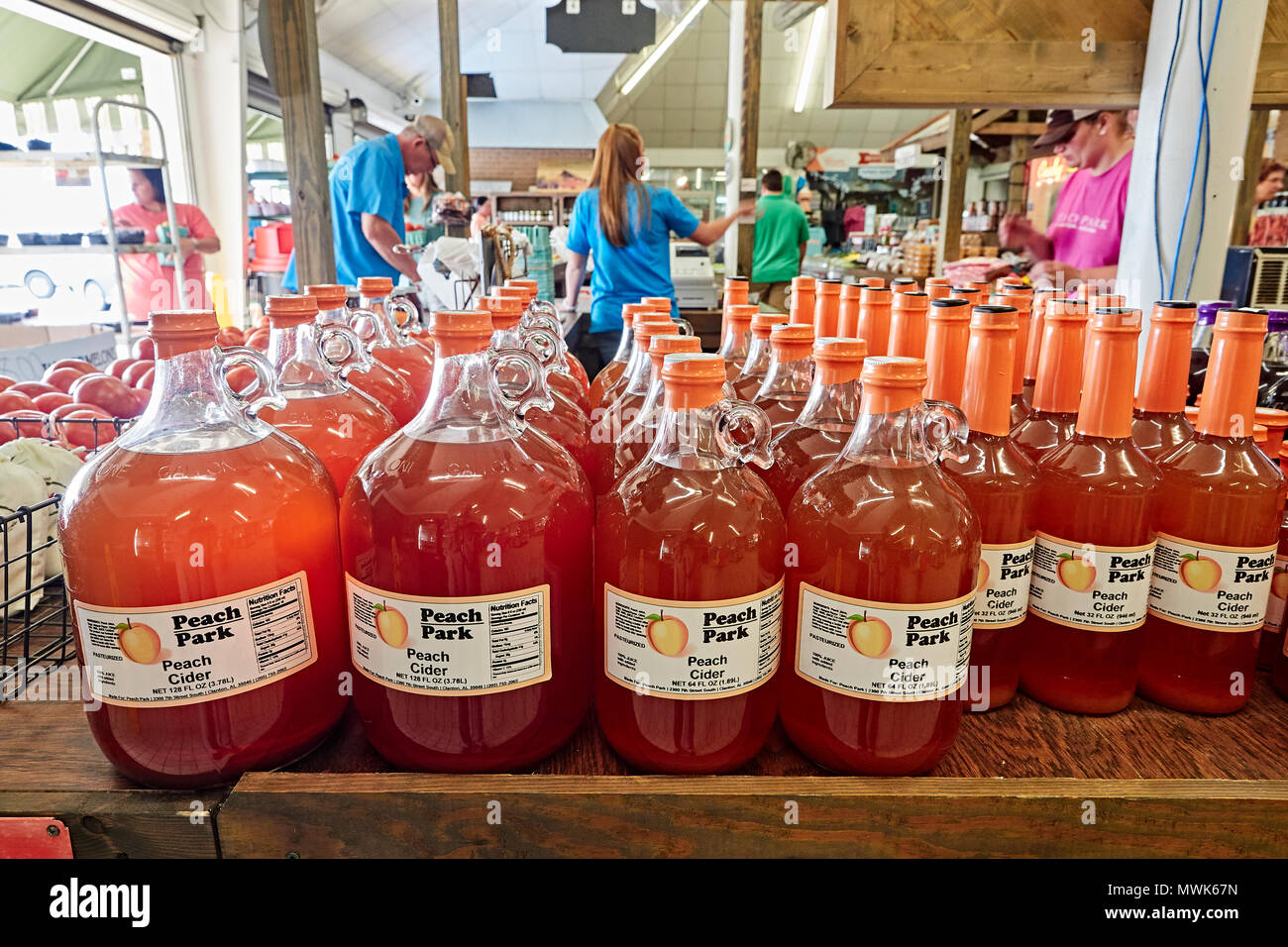 Rows of bottles of peach cider for sale at a roadside market in Clanton Alabama, USA. Stock Photo