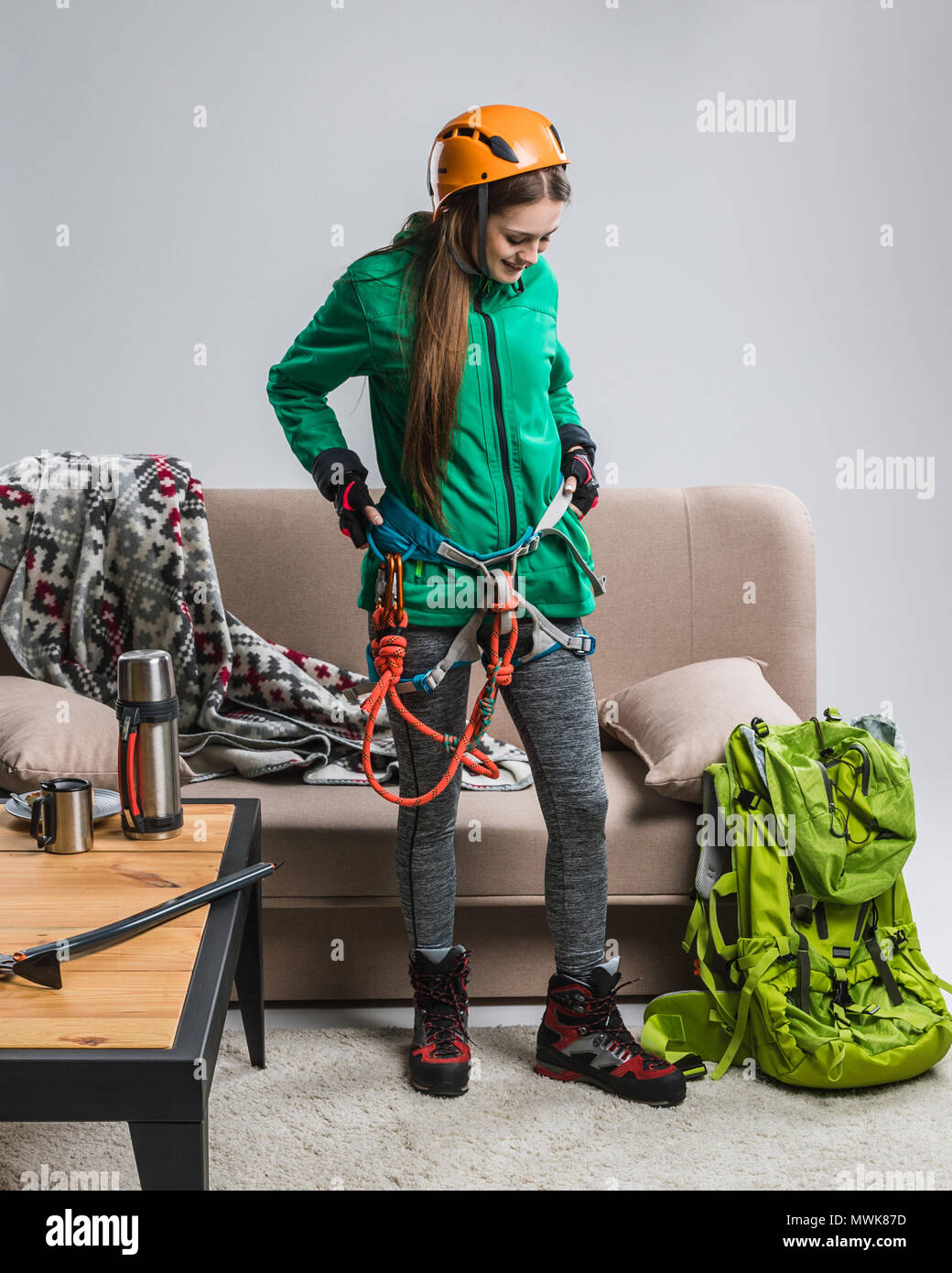 beautiful climber with climbing equipment at home Stock Photo Alamy