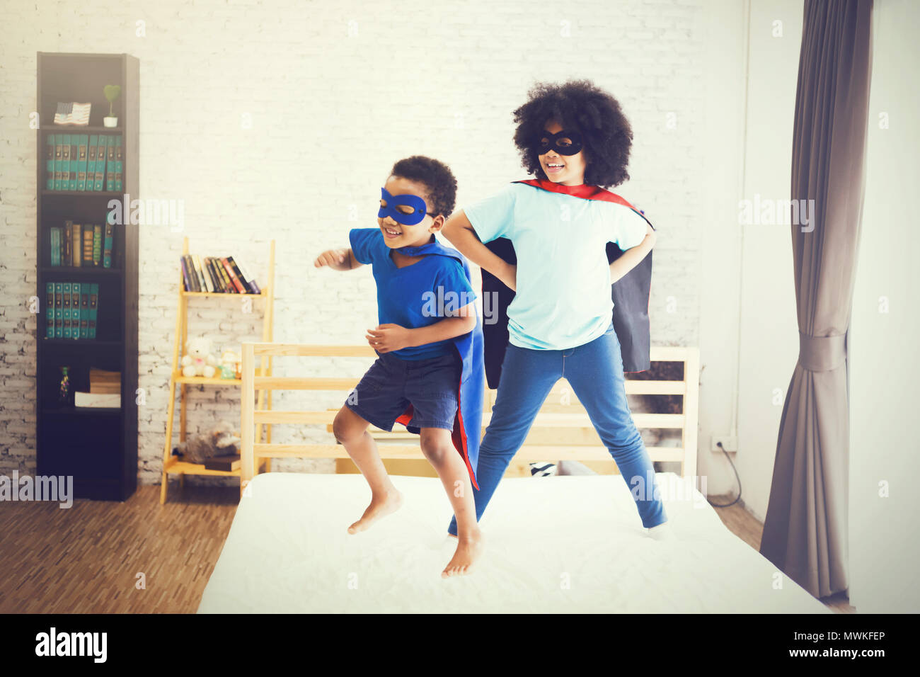 African American happy and confident young kids playing and dressing up