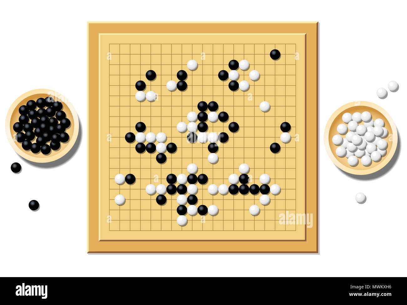 Gobang or go game board with a typical course of game, and two wooden bowls filled with black and white stones - a traditional chinese strategy game. Stock Photo