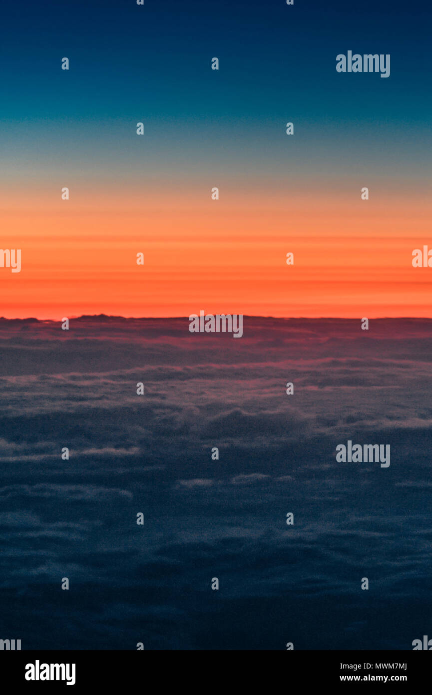 View of the clouds and sky above from the airplane window Stock Photo ...