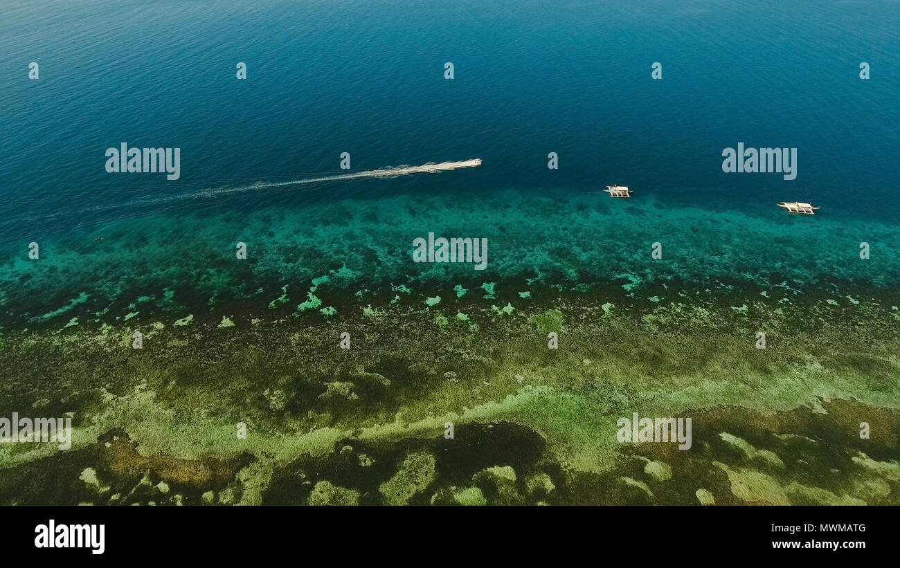 Aerial view of motor boat in sea. Aerial image of motorboat floating in
