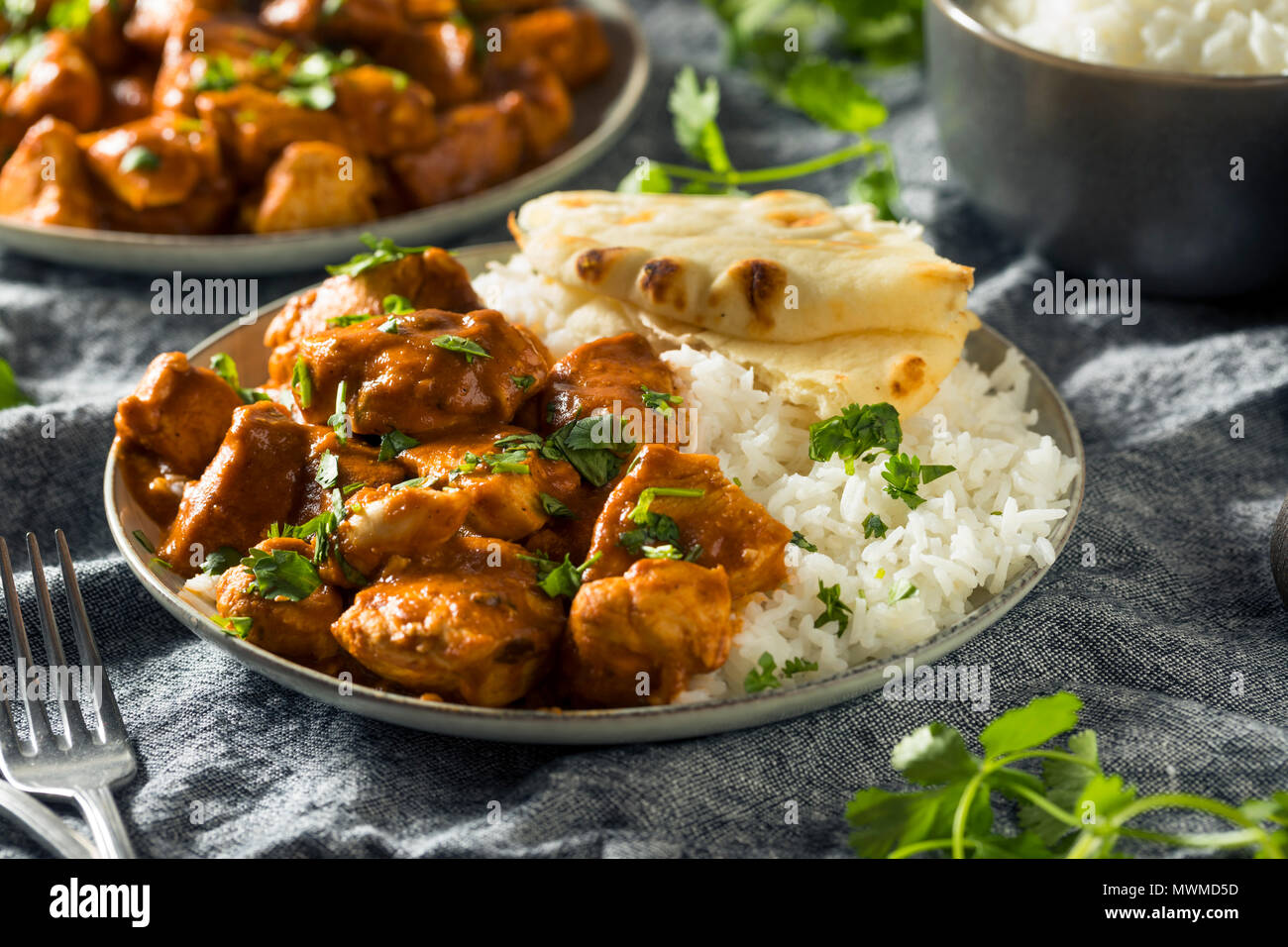 Homemade Chicken Tikka Masala with Rice and Naan Stock Photo