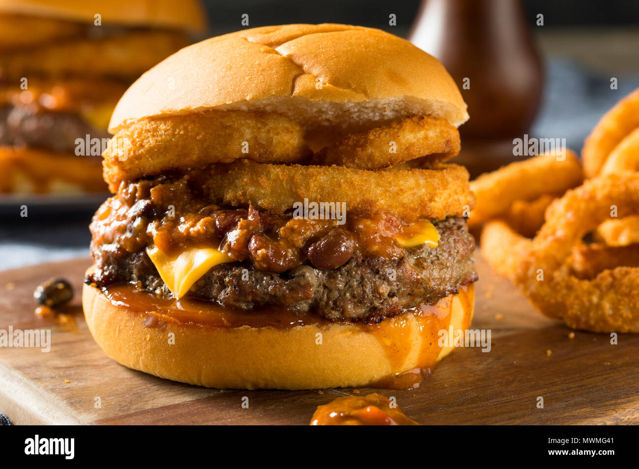 Homemade Barbecue Chili Cheeseburger with Onion Rings Stock Photo Alamy