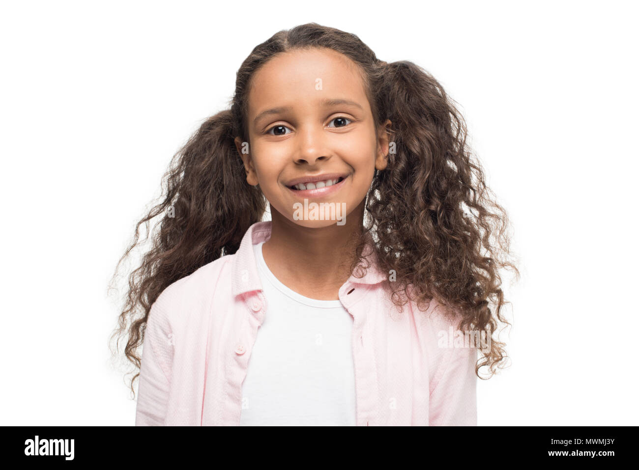 Portrait of adorable little girl smiling at camera isolated on white ...