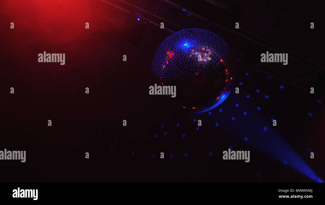 Beautiful Disco Ball Spinning seamless with flares. Mirror ball with