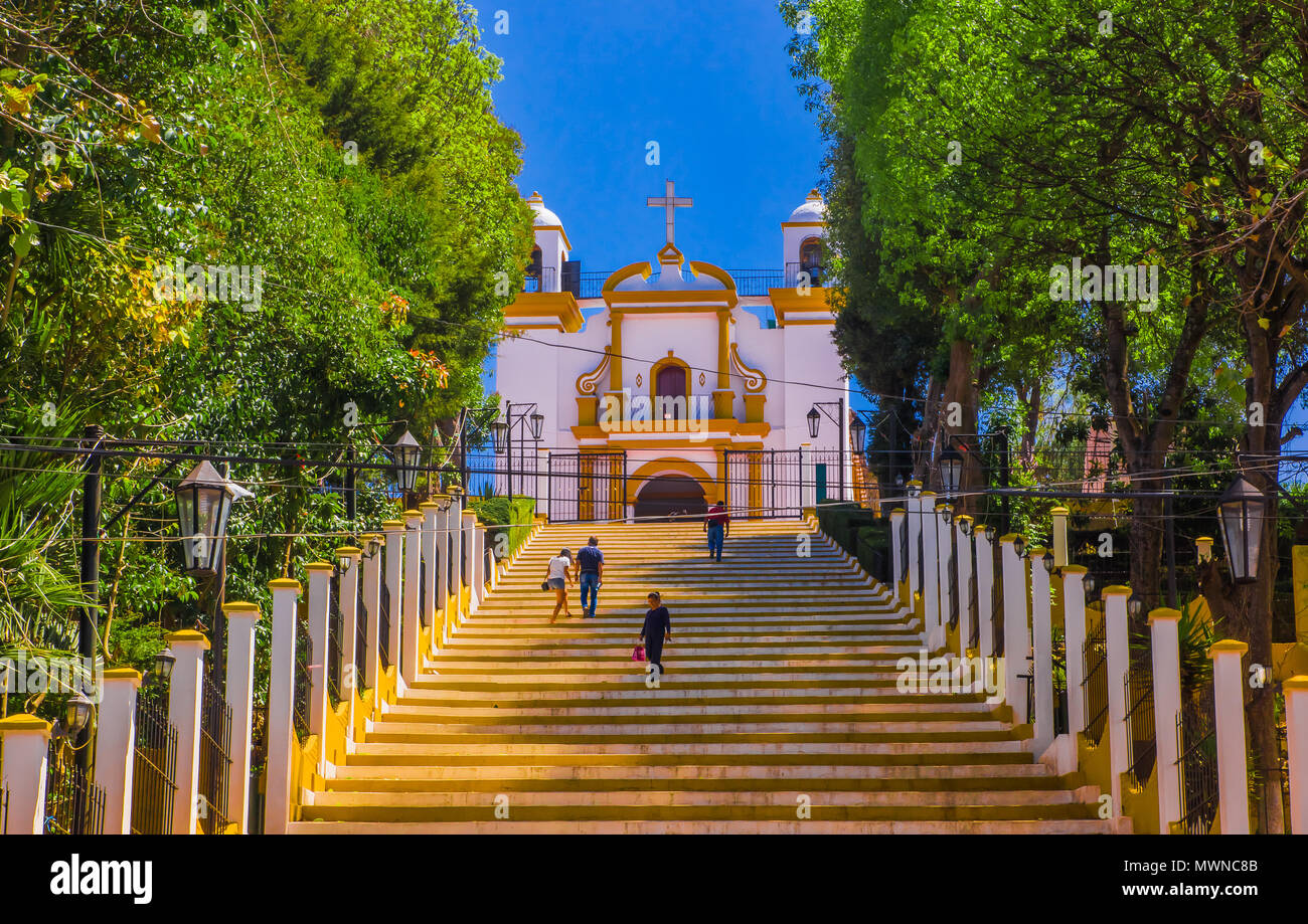 SAN CRISTOBAL DE LAS CASAS, MEXICO, MAY, 17, 2018: Outdoor view of christian Catholic chapel on a hill with colorful steps in San Cristobal de las Casas, Chiapas Stock Photo