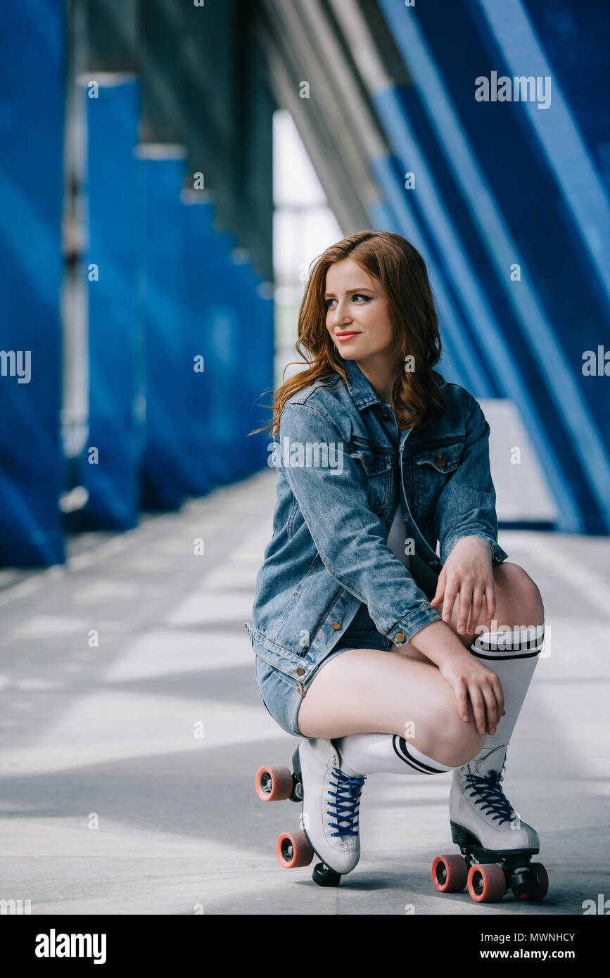young stylish woman in denim clothes, high socks and retro roller skates  looking away Stock Photo - Alamy