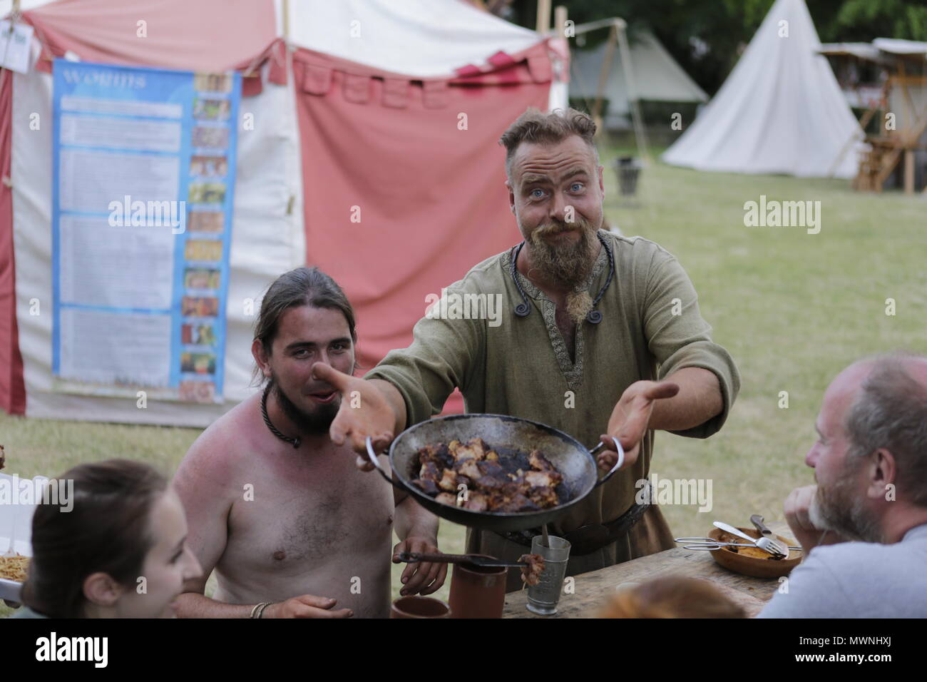 Man cooking meat medieval festival hi-res stock photography and images ...
