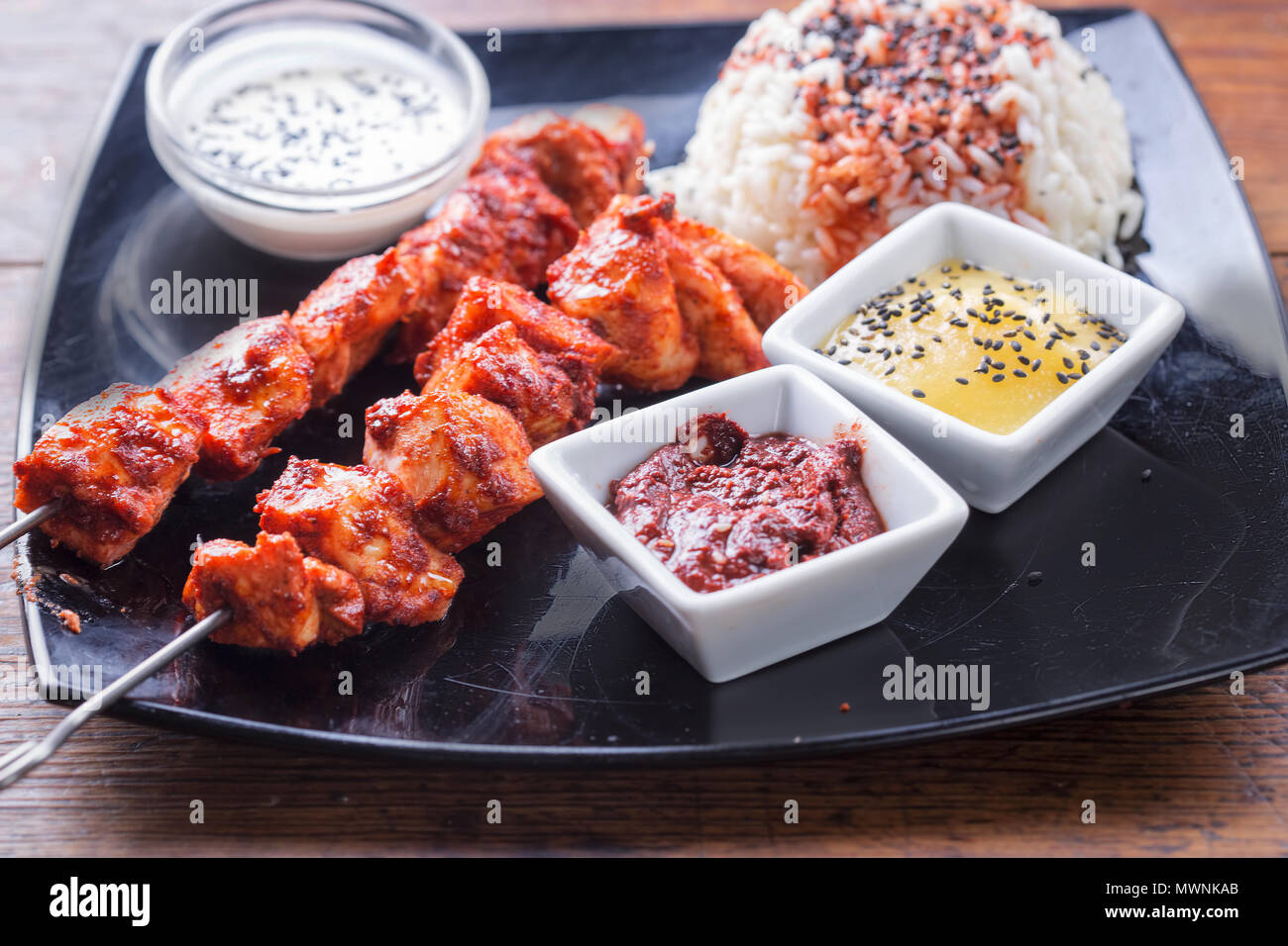 Chicken tandoori skewers with rice and sauces Stock Photo Alamy