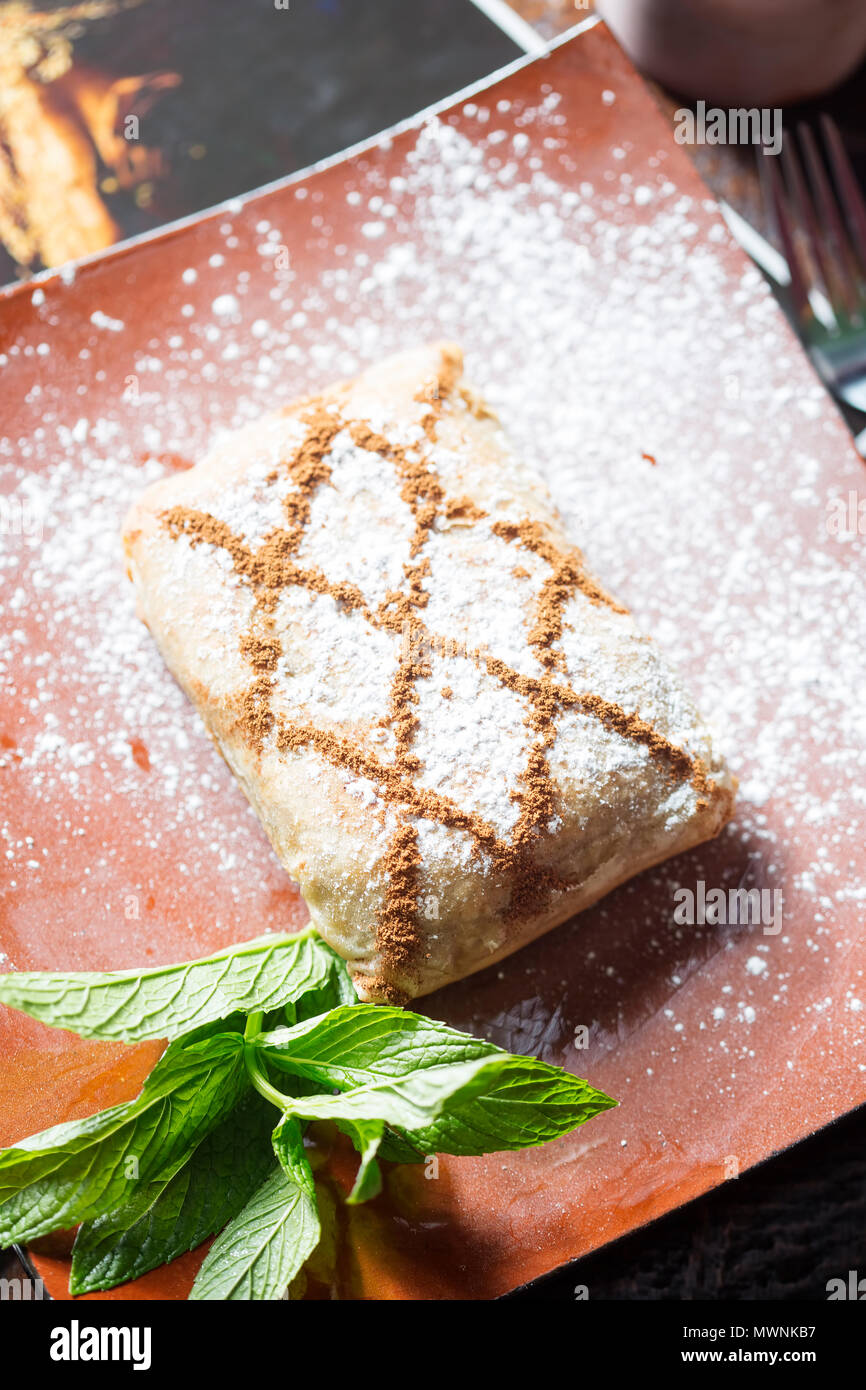 Chicken and cinnamon Moroccan savoury sweet fillo pastry Stock Photo