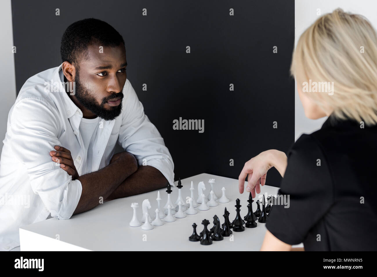 Senior man planning his next chess move, Stock image
