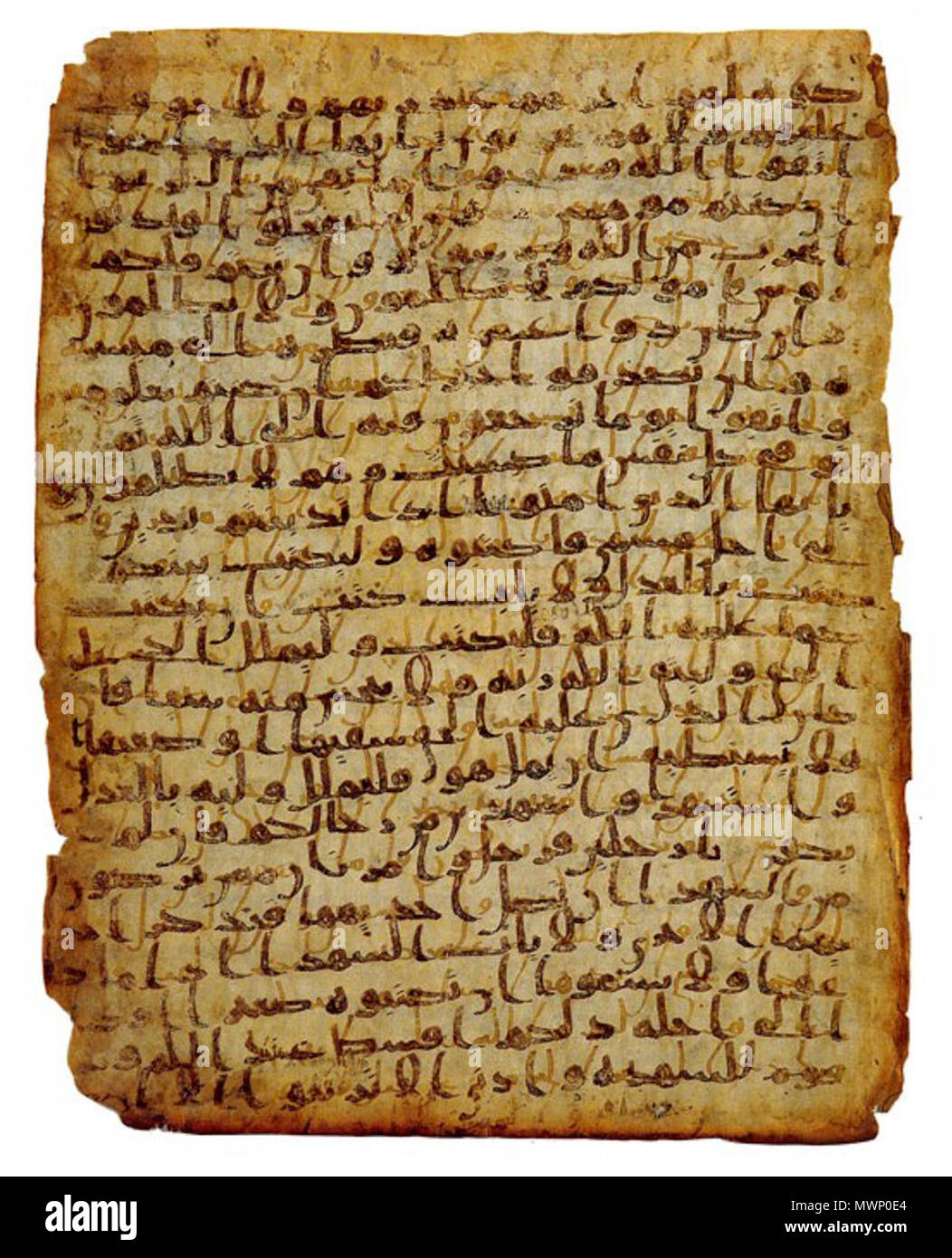 . English: Manuscript on vellum, written in sepia-coloured Hijazi script. An Early Qur'anic Manuscript (1st century Hegira). From the last two words of verse 206 to the second fīhi in verse 217 of Sūrah al-Baqarah. Script: Hijazi. Location: The David Collection, Copenhagen. Middle of 1st century Hegira (mid-late 7th century CE). Unknow calligrapher 509 Qur'anic Manuscript - 4 - Hijazi script Stock Photo