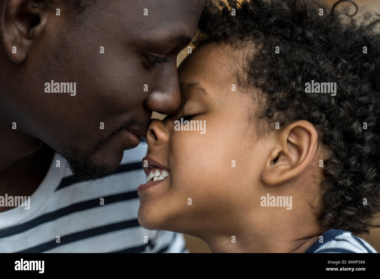 close-up portrait of beautiful happy african american father and son ...