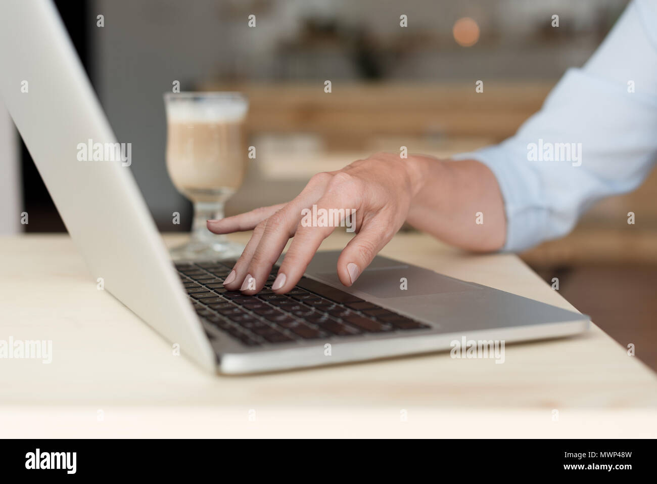 Mature woman typing on laptop hi-res stock photography and images - Alamy