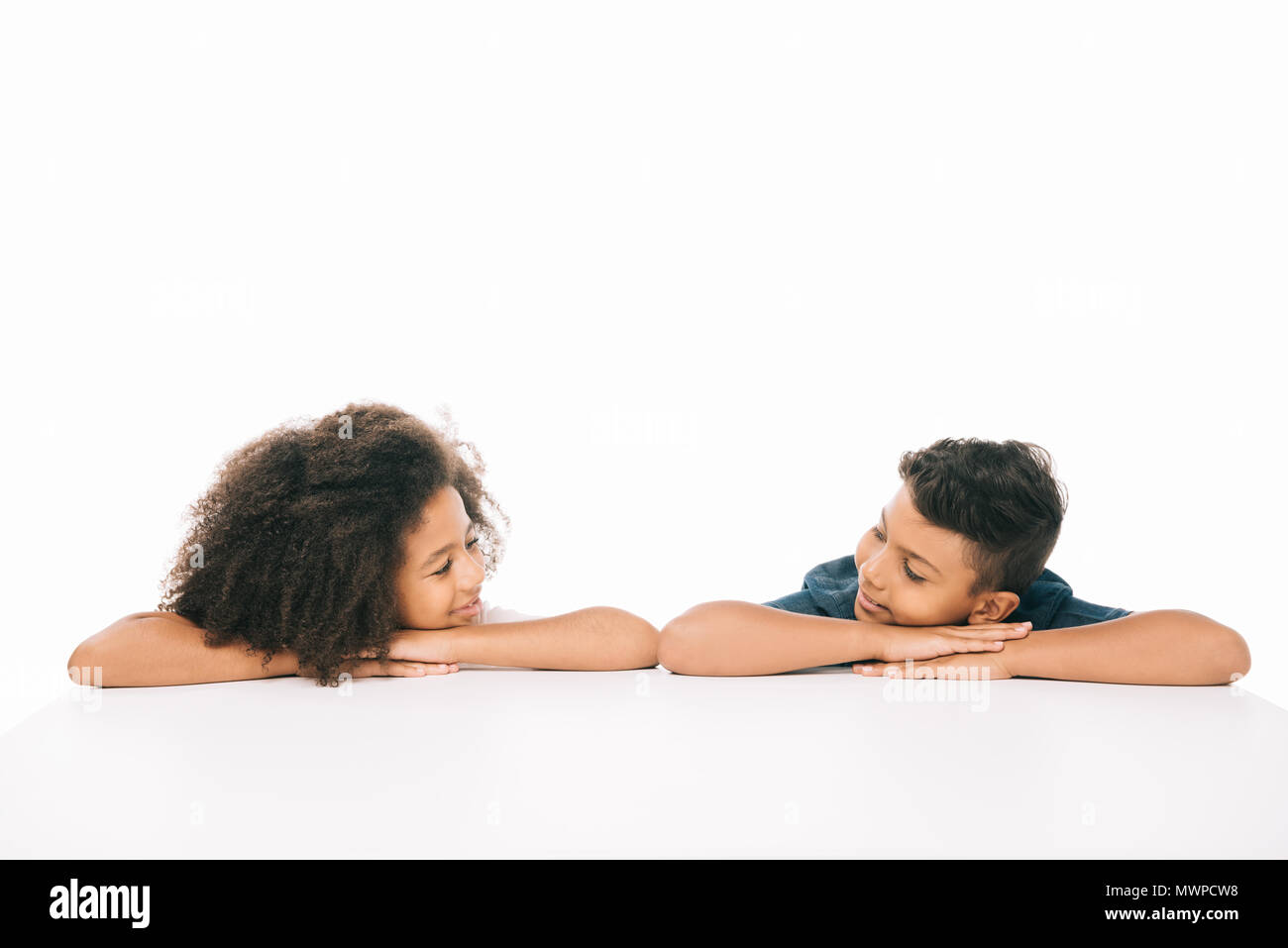 Beautiful African American Brother And Sister Smiling Each Other Isolated On White Beautiful African American Brother And Sister Smiling Each Other Isolated On White