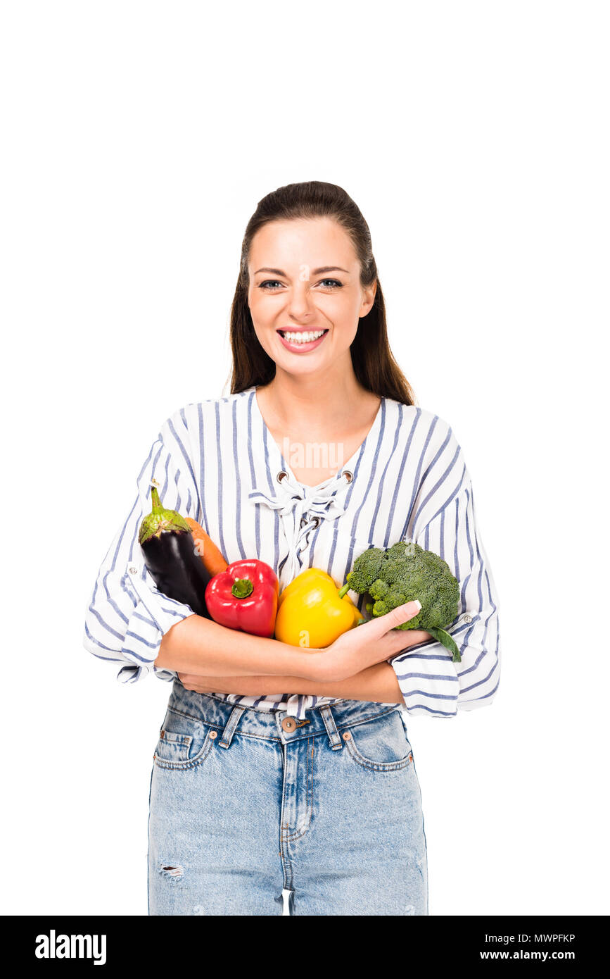 portrait of smiling woman with various fresh vegetables isolated on ...
