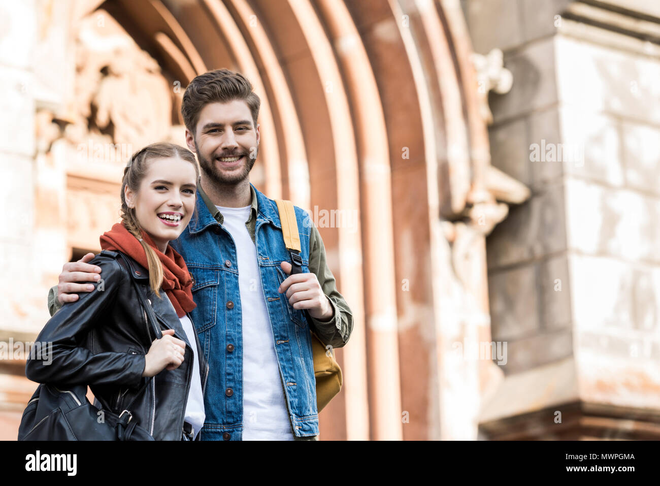 stylish young couple in love looking at camera on street Stock Photo ...