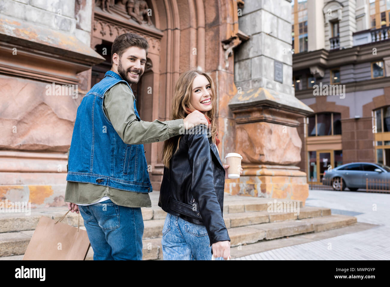 back view of stylish couple in love walking on street Stock Photo - Alamy