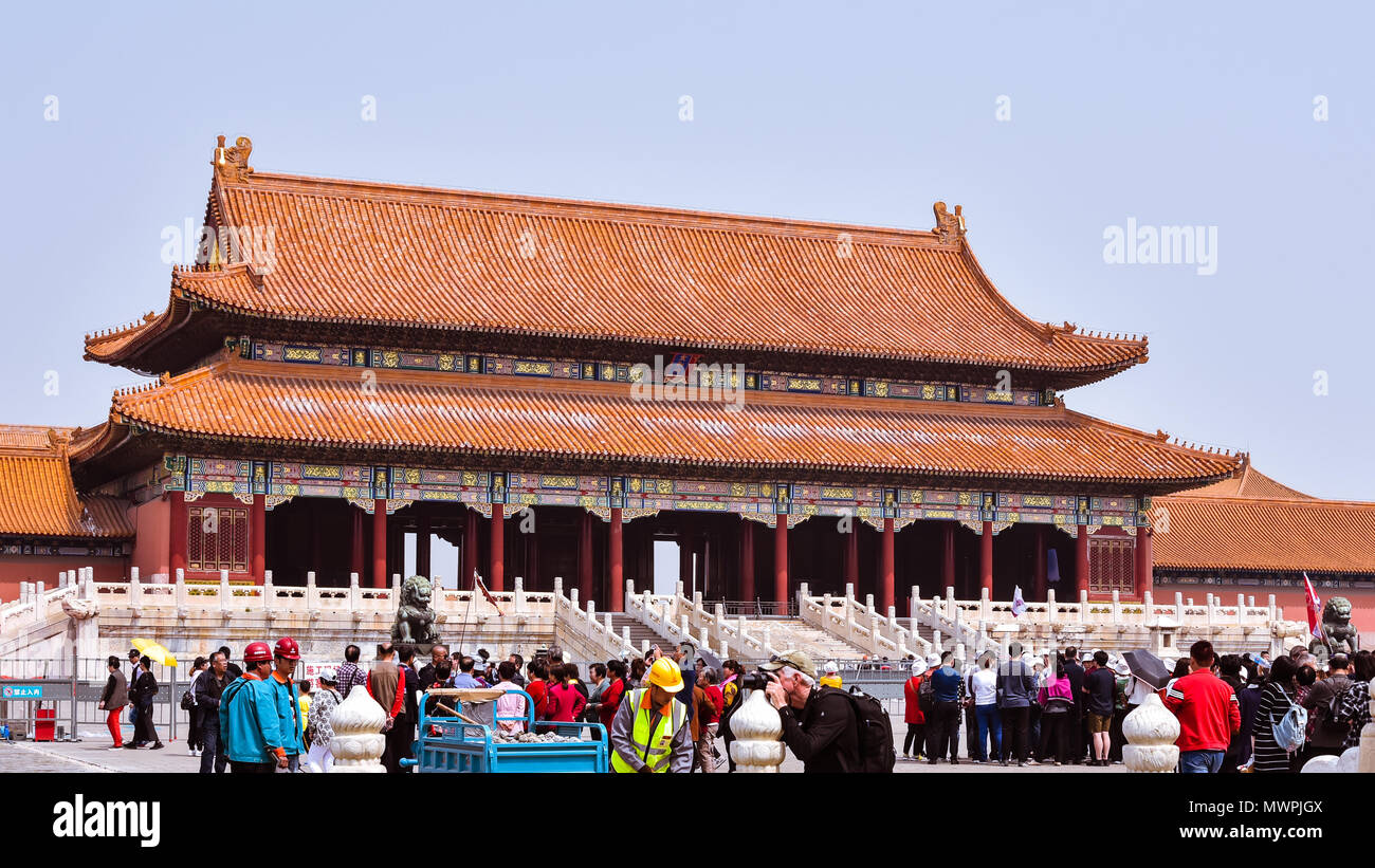 Beijing, China - Apr. 18, 2018: Tourists visit the Gate of Supreme Harmony in the Forbidden City, Beijing, China. Stock Photo