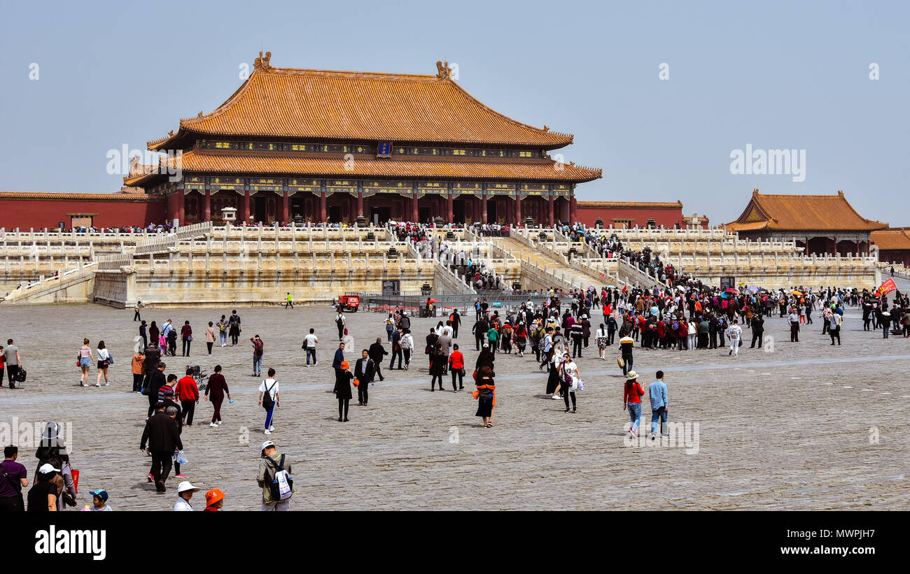 Beijing, China - Apr. 18, 2018: Tourists visit the Hall of Supreme Harmony in the Forbidden City, Beijing, China. Stock Photo