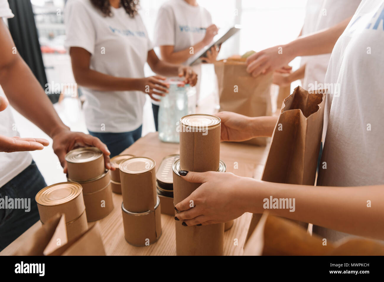 Volunteers sorting donations hi-res stock photography and images - Alamy