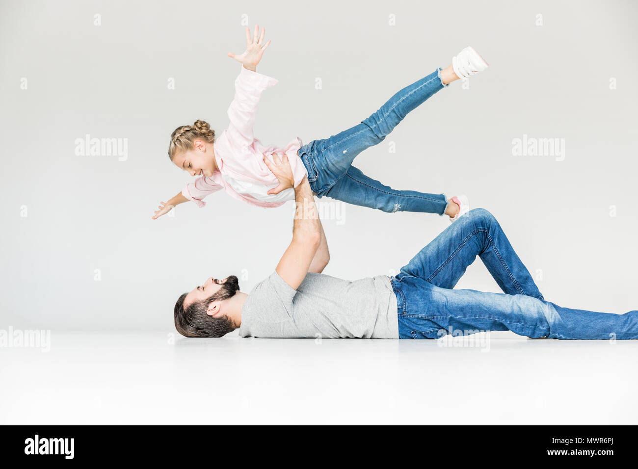 beautiful happy father and daughter having fun together isolated on ...