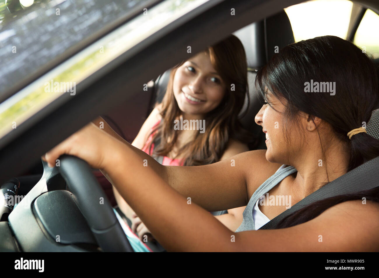 Friends driving taking a road trip. Stock Photo