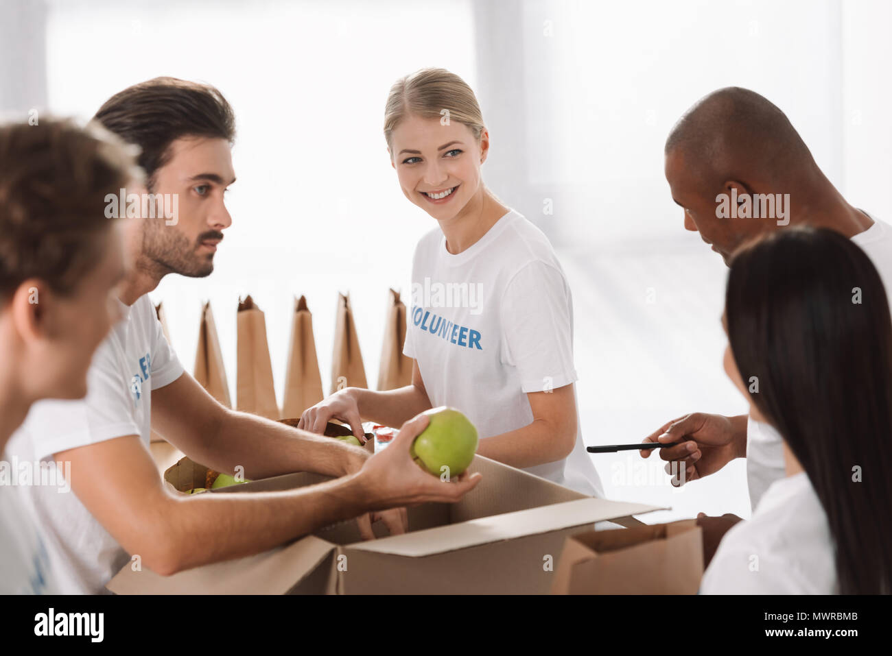 Young black men volunteering hi-res stock photography and images - Alamy