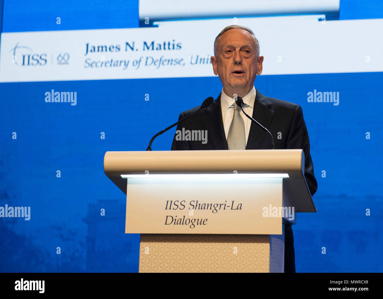 180602-N-OU129-223 SINGAPORE (June 1, 2018) Secretary of Defense Jim Mattis delivers remarks during the first plenary session of the Shangri-La Dialogue 2018 June 2. The Shangri-La Dialogue, held annually by the independent think tank, the International Institute for Strategic Studies (IISS), is an inter-governmental security forum which is attended by defense ministers and delegates from more than 50 nations. (U.S. Navy photo by Mass Communication Specialist 2nd Class Joshua Fulton/Released) Stock Photo