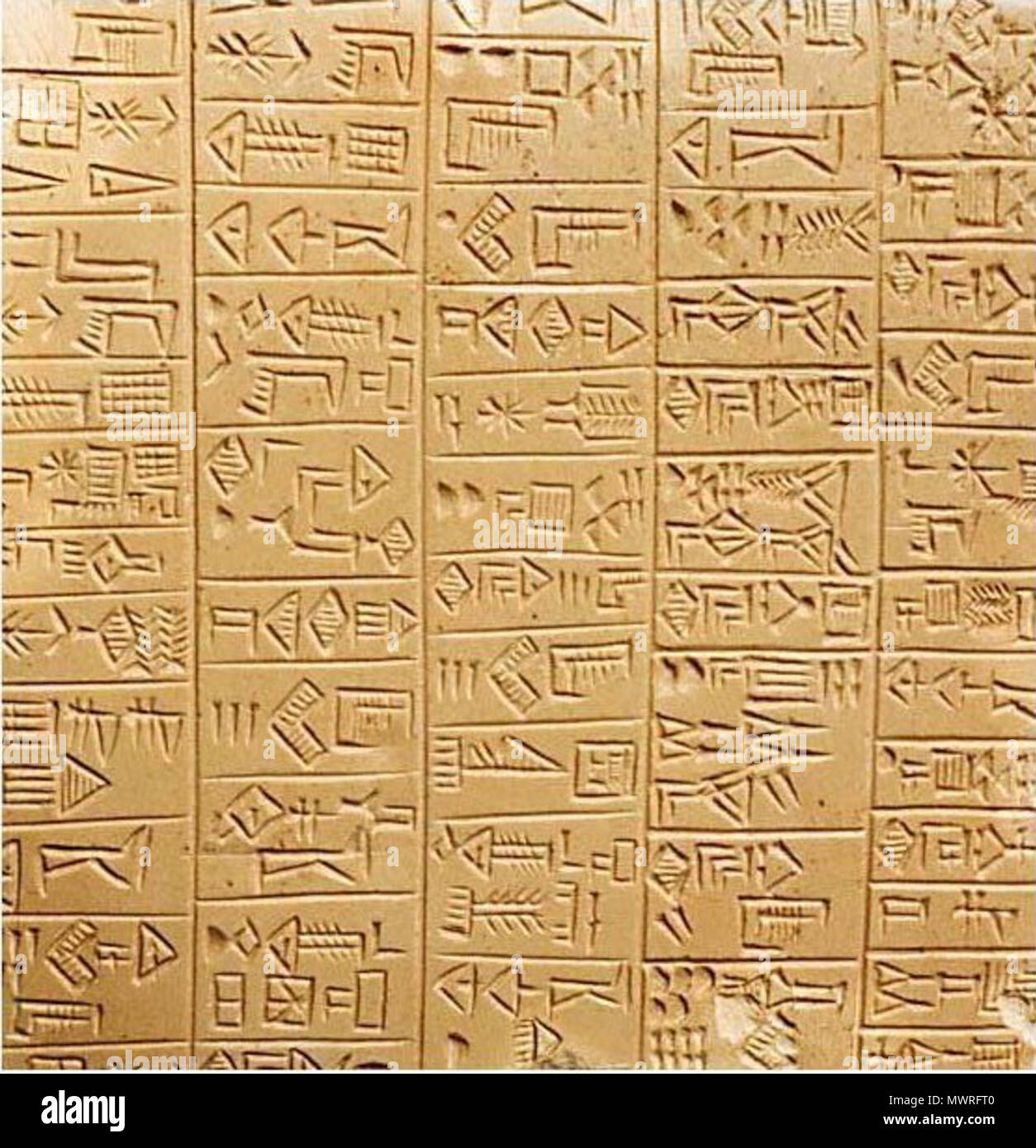 . English: Schøyen Collection MS 3029. Sumerian inscription on a creamy stone plaque, 9.2 x 9.2 x 1.2 cm, 6+6 columns, 120 compartments of archaic monumental cuneiform script by an expert scribe. The image is a detail, showing about half of one face of the plaque. The text is a list of 'gifts from the High and Mighty of Adab to the High Priestess, on the occasion of her election to the temple'. 26th century BC. Unknown 581 Sumerian 26th c Adab Stock Photo