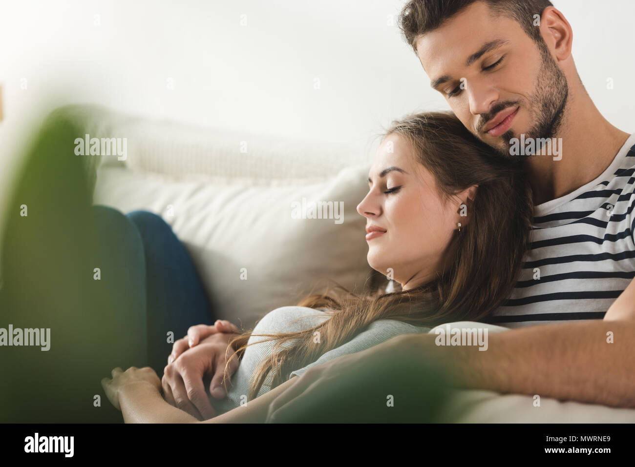 Young romantic couple sleeping on hi-res stock photography and