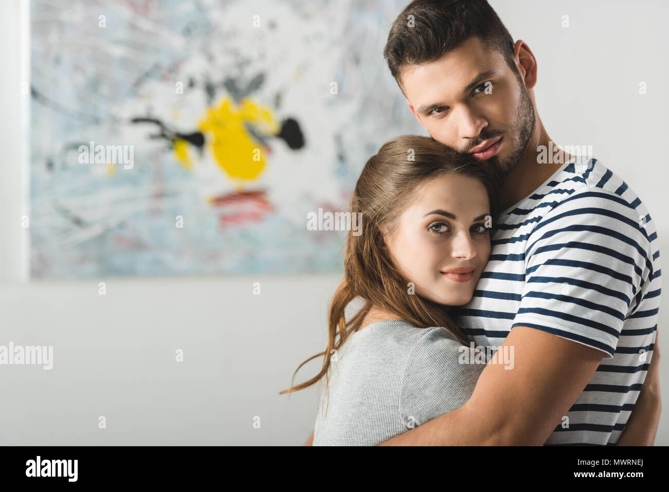 Young beautiful couple embracing hi-res stock photography and images ...