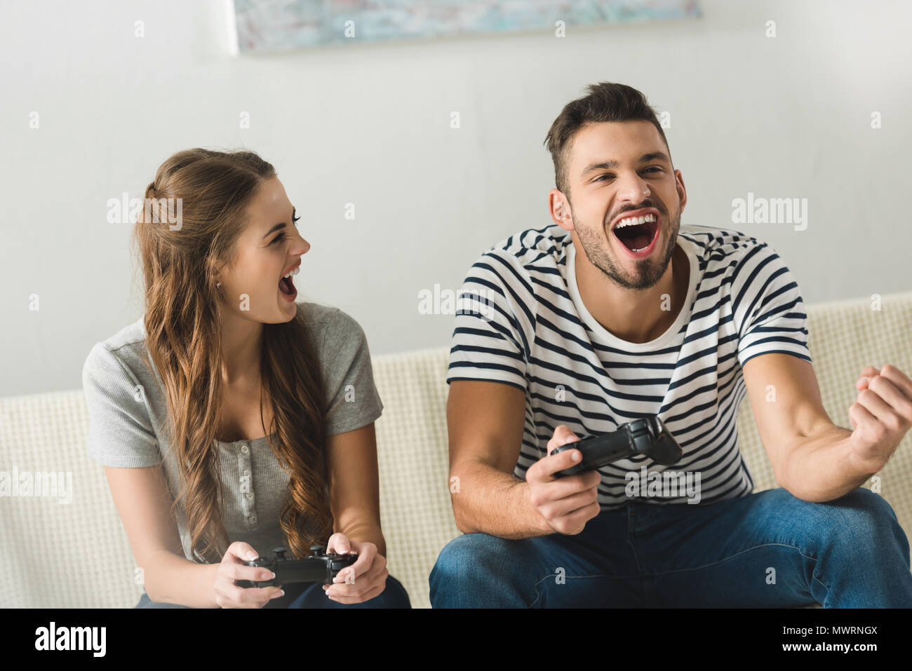 Couple playing games hi-res stock photography and images - Alamy