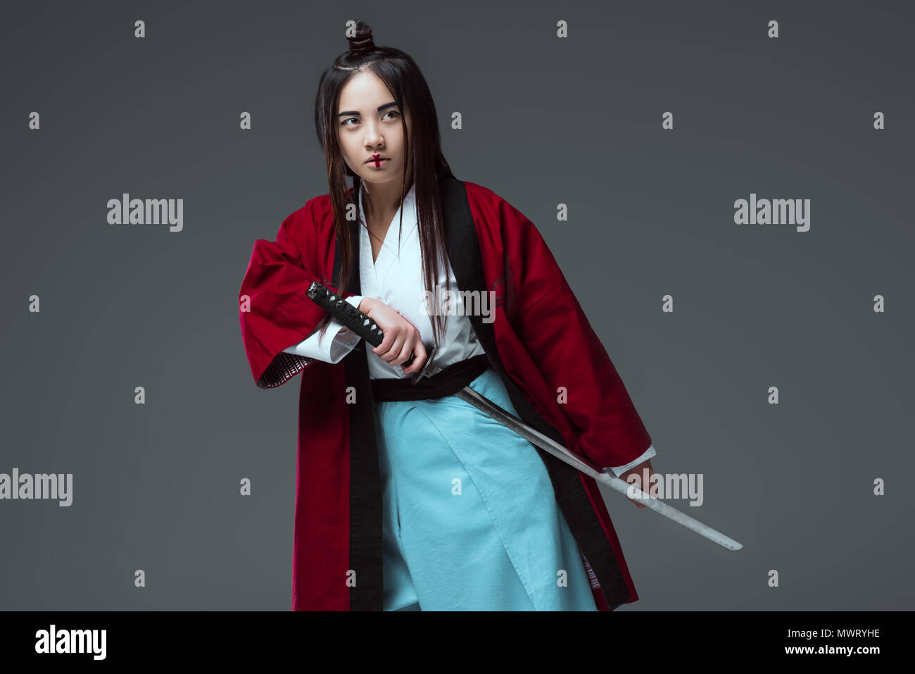 Beautiful female warrior holding katana hires stock photography and
