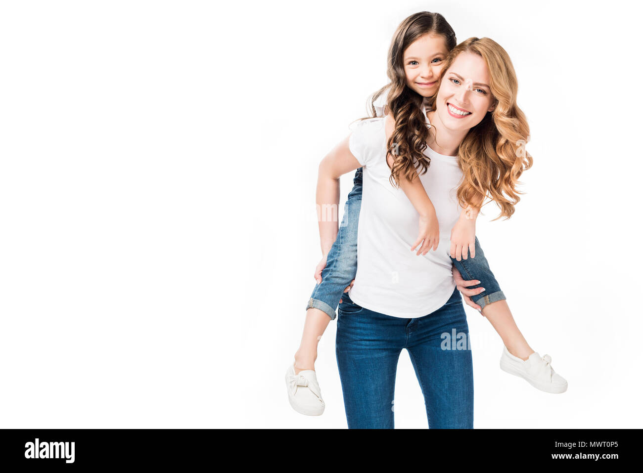 happy mother and daughter piggybacking together isolated on white Stock Photo