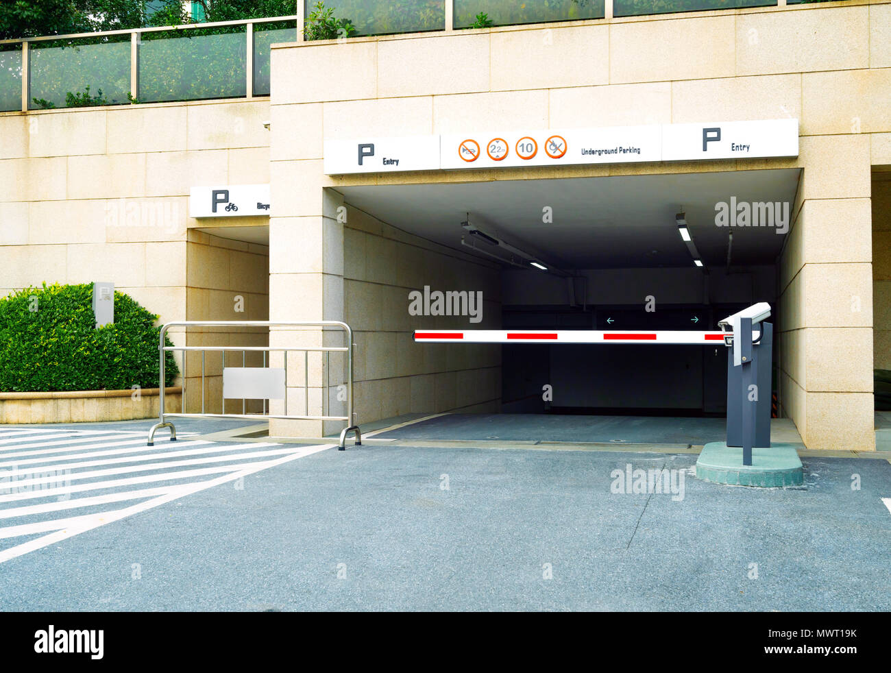 Ramp access to underground public parking garage Stock Photo