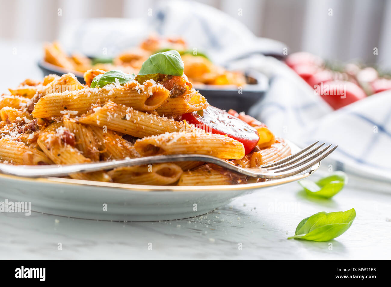 Italian food and pasta pene with bolognese sause on plate Stock Photo -  Alamy