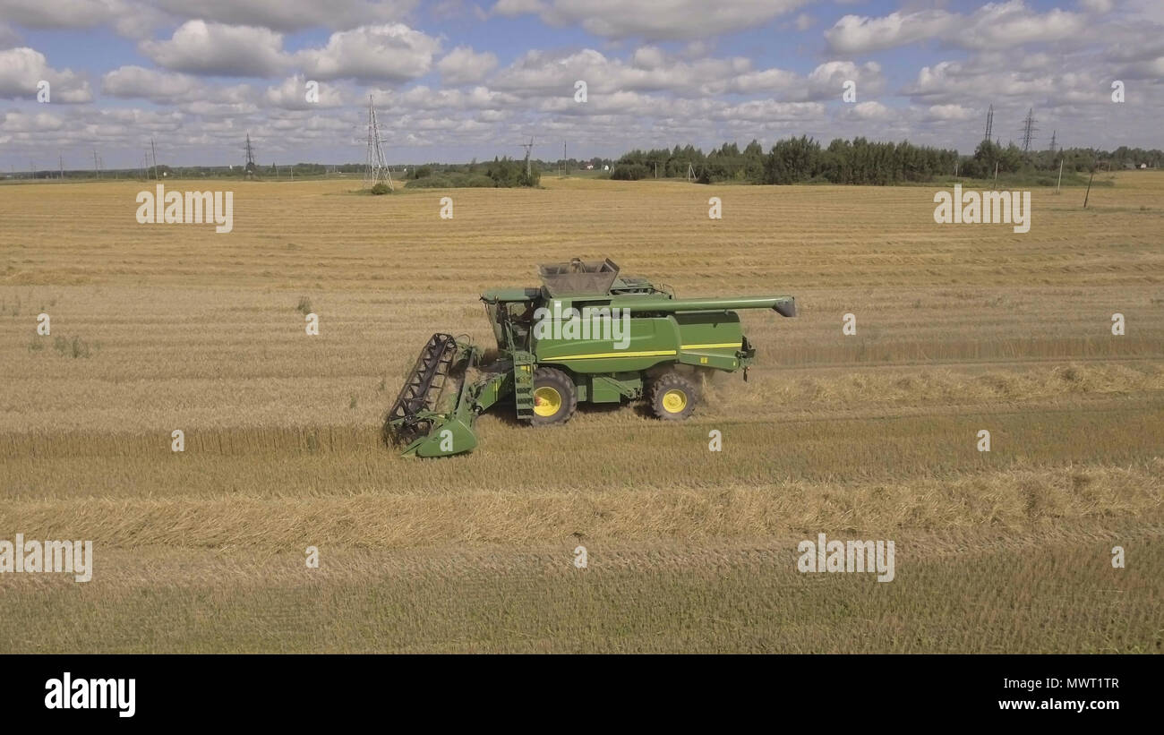 Combine harvester on a wheat field at harvest.Aerial view of ...
